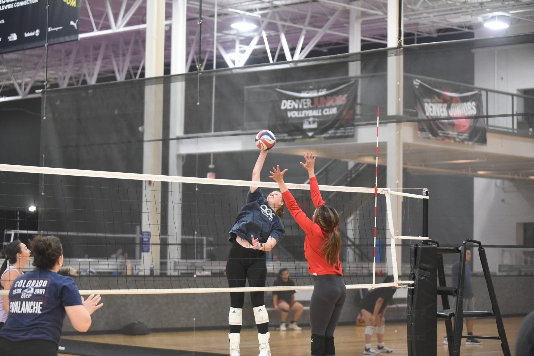 Boomtown volleyball tournament action at the net