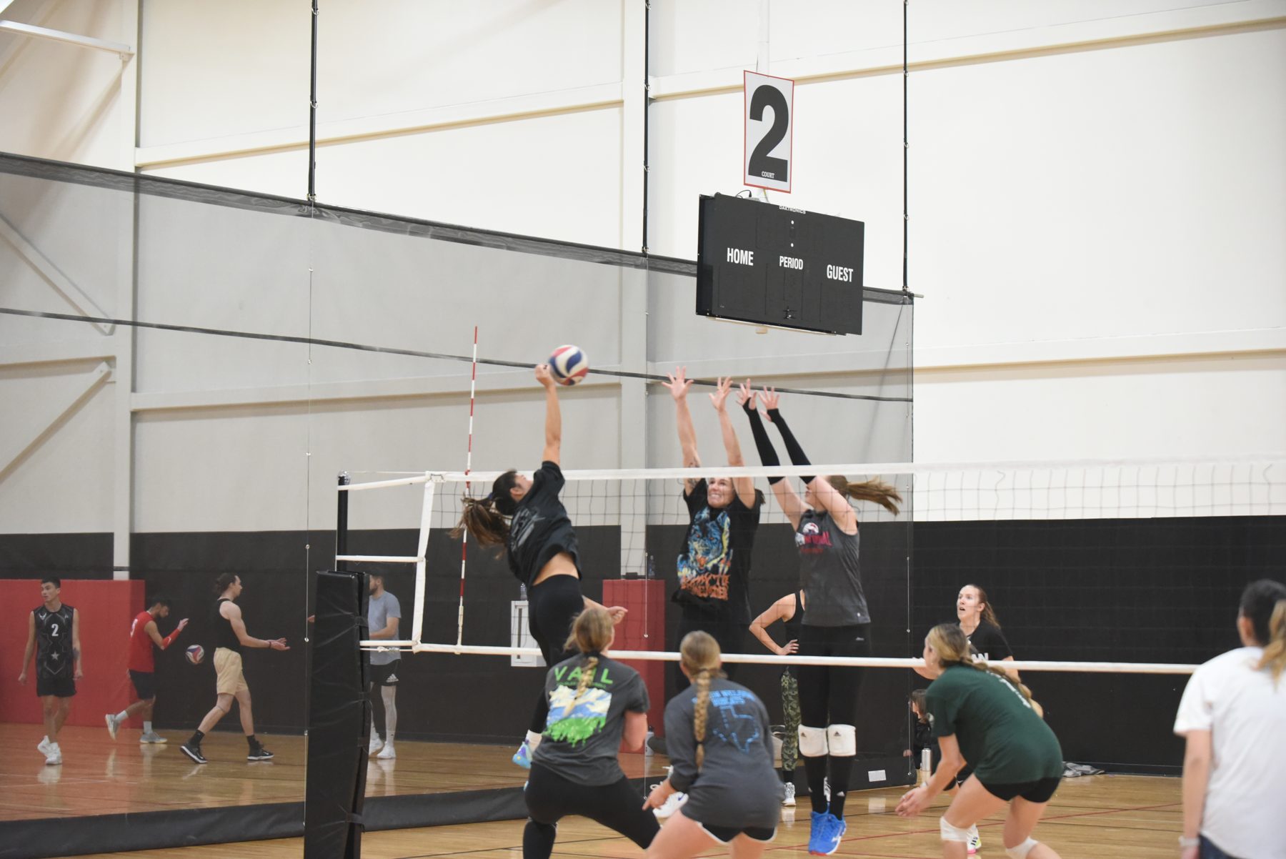 Boomtown players competing at the net during a tournament match