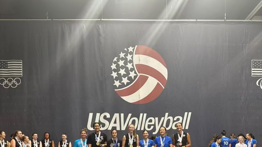 Boomtown Athletics women’s team on the USA Volleyball tournament podium with medals