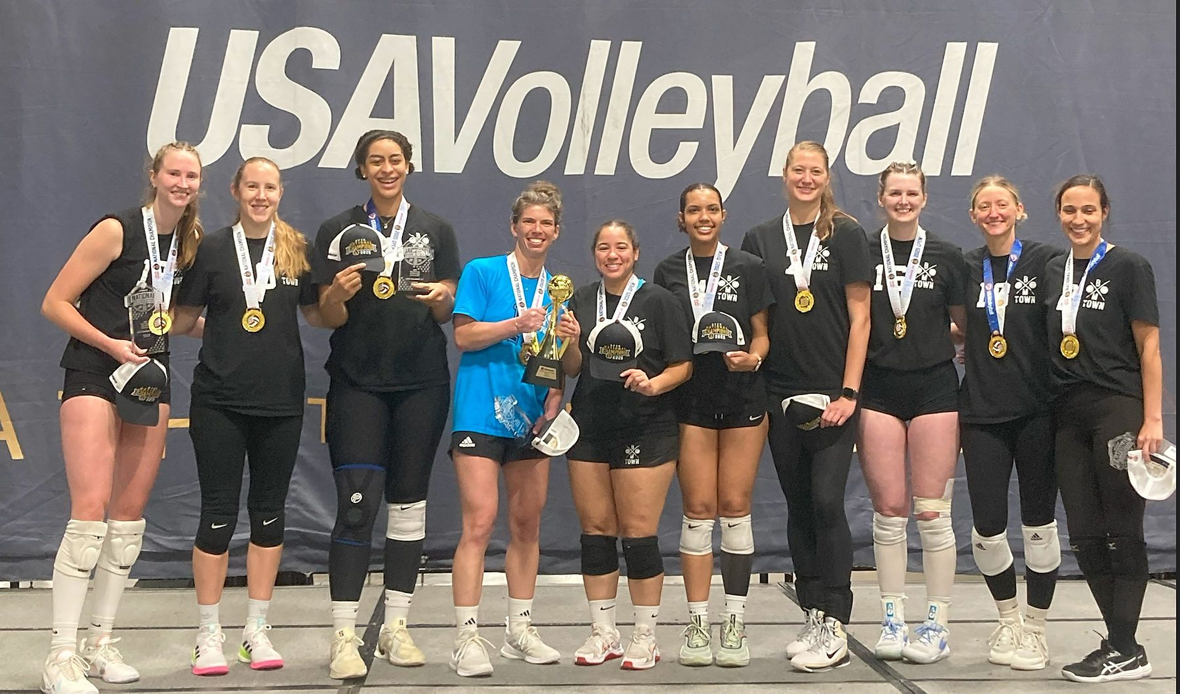 Boomtown Athletics women’s team, USA Volleyball national champions, with the championship trophy